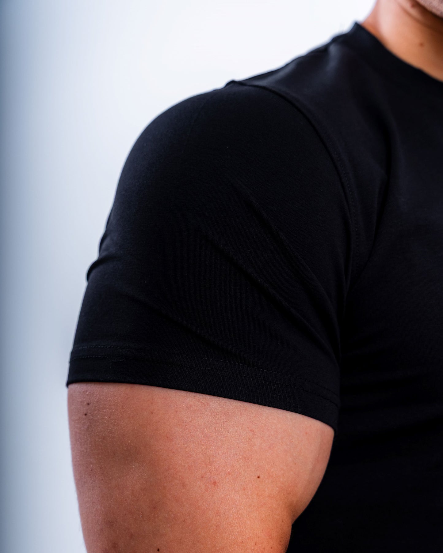 EVOLVE® BLACK MUSCLE TEE